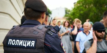 police standing in front of crowd