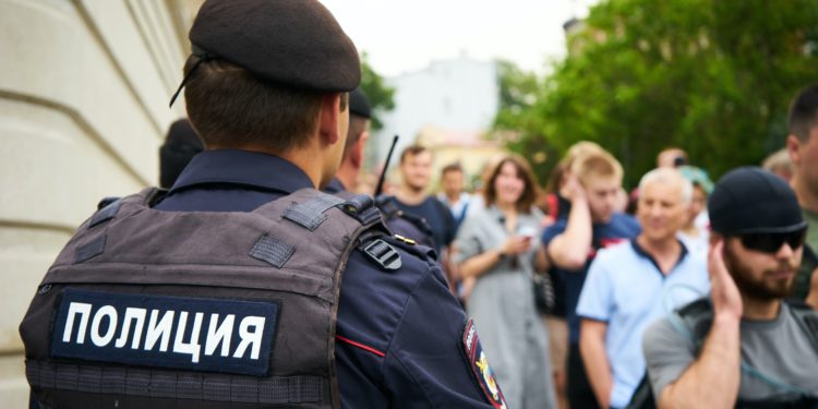 police standing in front of crowd