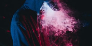 hooded man vaping