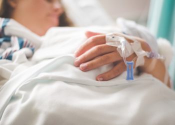 person in hospital bed