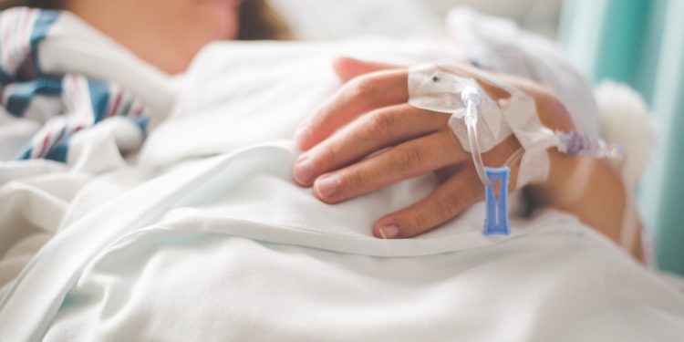 person in hospital bed