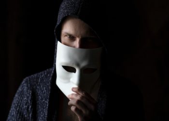 man removing mask