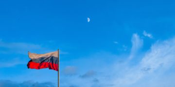 Russian flag, blue sky.