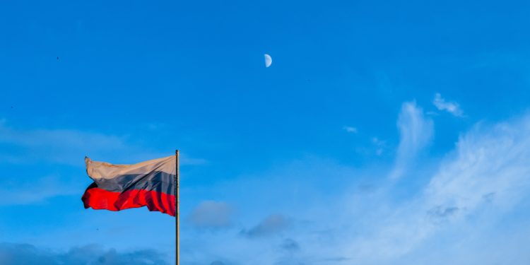 Russian flag, blue sky.