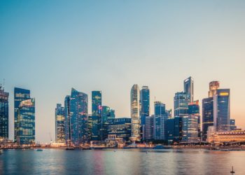 Singapore skyline full of skyscrapers at sunset.