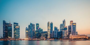 Singapore skyline full of skyscrapers at sunset.