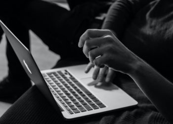 Hands on laptop keyboard