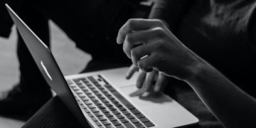 Hands on laptop keyboard
