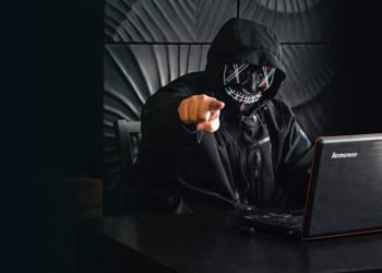 man in mask pointing