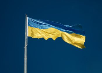 Blue and Yellow flag flying in blue sky (Ukraine)