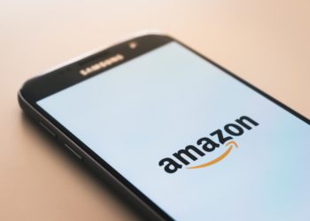 Mobile phone, white screen, Amazon written.