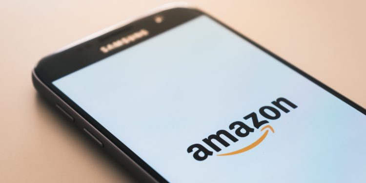 Mobile phone, white screen, Amazon written.