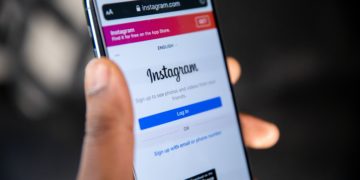 Mobile phone in hand with Instagram app open