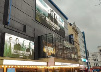 Outside of cinema with advertising