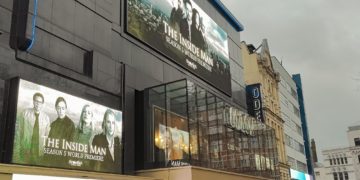 Outside of cinema with advertising