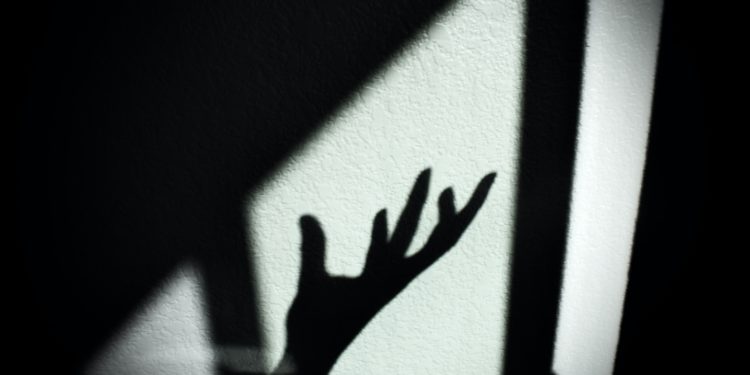 Shadowed hand