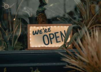 'open' sign on window ledge