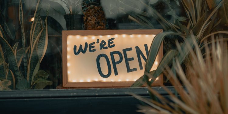 'open' sign on window ledge